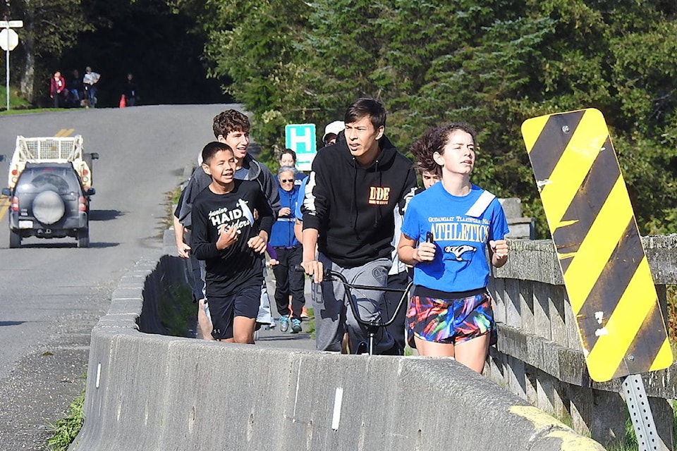 Runners and cyclists cross Hodges Avenue bridge for the Terry Fox Run in Masset on Sept. 15. (Archie Stocker Sr. photo)