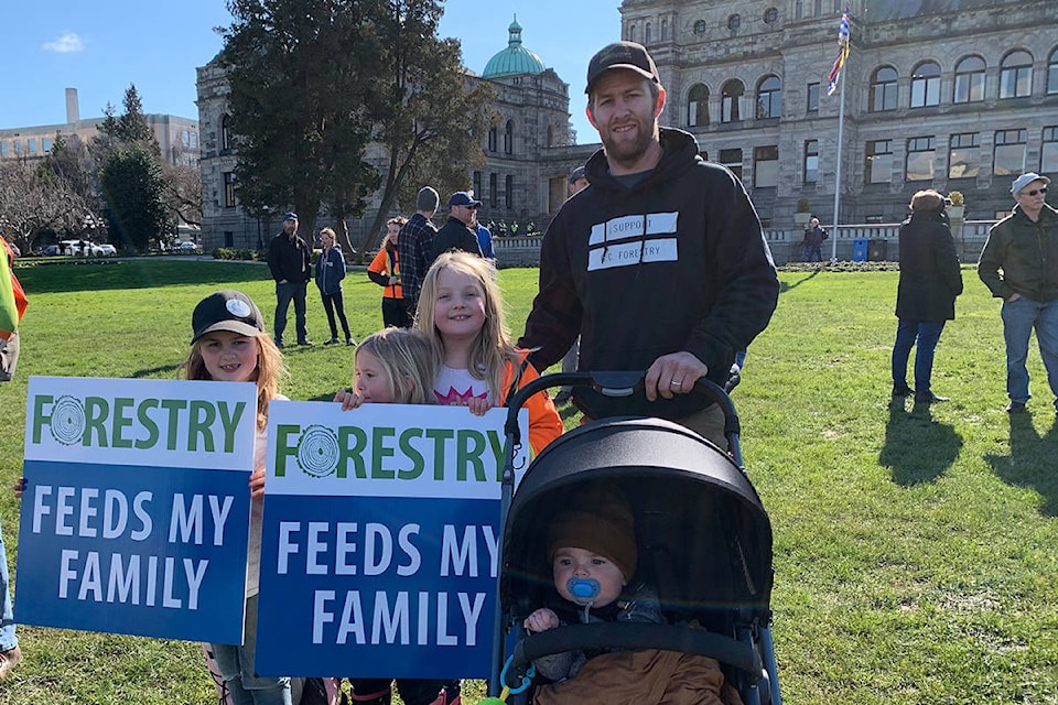 Dana Hoodikoff with kids Emma, Lyla, Kaycee, Grady came from Campbell River for a rally on the lawn of the B.C. legislature on Feb. 18 in support of the forestry industry. (Shalu Mehta/News Staff)
