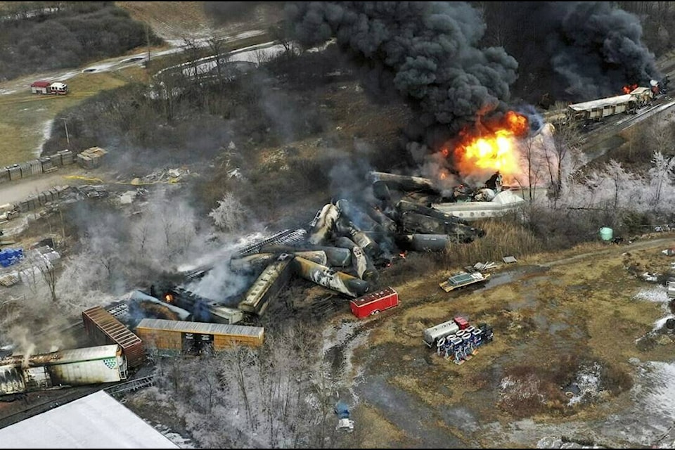 FILE - In this photo taken with a drone, portions of a Norfolk Southern freight train that derailed the previous night in East Palestine, Ohio, remain on fire at mid-day on Feb. 4, 2023. Transportation Secretary Pete Buttigieg announced a package of reforms to improve safety Tuesday, Feb. 21 — two days after he warned the railroad responsible for the derailment, Norfolk Southern, to fulfill its promises to clean up the mess just outside East Palestine, and help the town recover. (AP Photo/Gene J. Puskar, File)