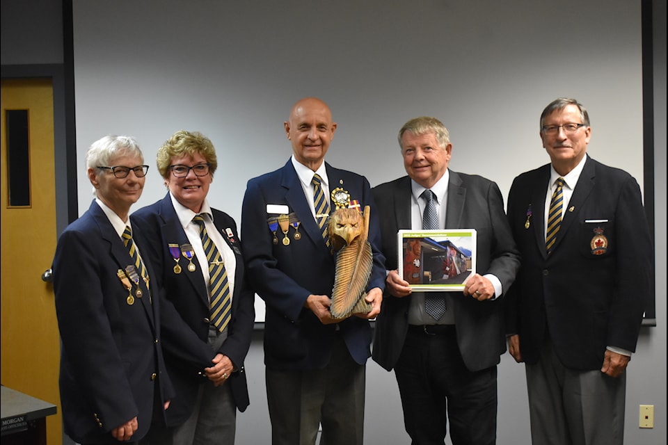 Ian Williams (middle left) standing with Mayor Victor Smith (middle right) and Hope Legion members Leane Tourigny (far left), Heather Bergstrom (second left) and Mike Demoskoff (far right). 
