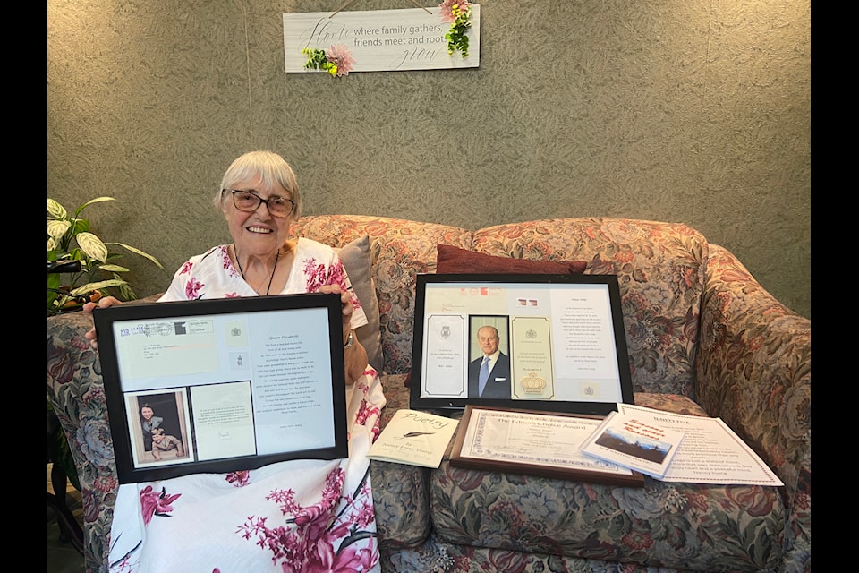 Nancy Perry Young with her poems and the letters she received from Queen Elizabeth II and King Charles III.