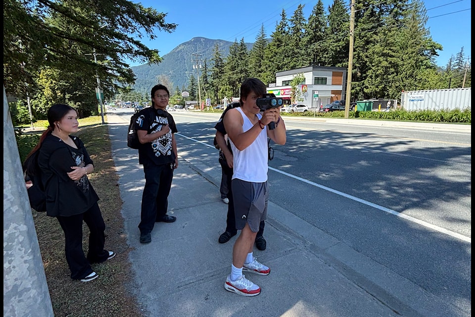 Teenagers using a radar gun during the Hope RCMP's Youth Career Day open house on June 7, 2025. 