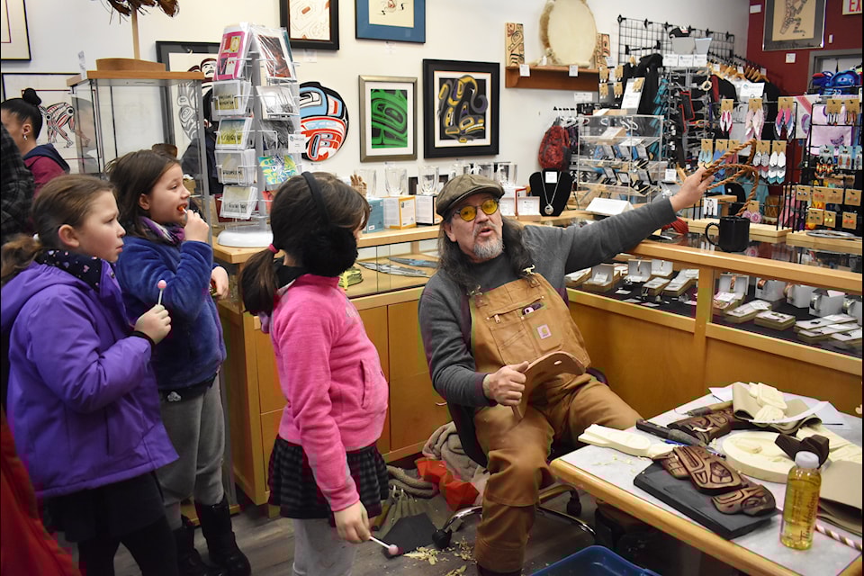 Kids learning how to make cedar rope from George Price. 