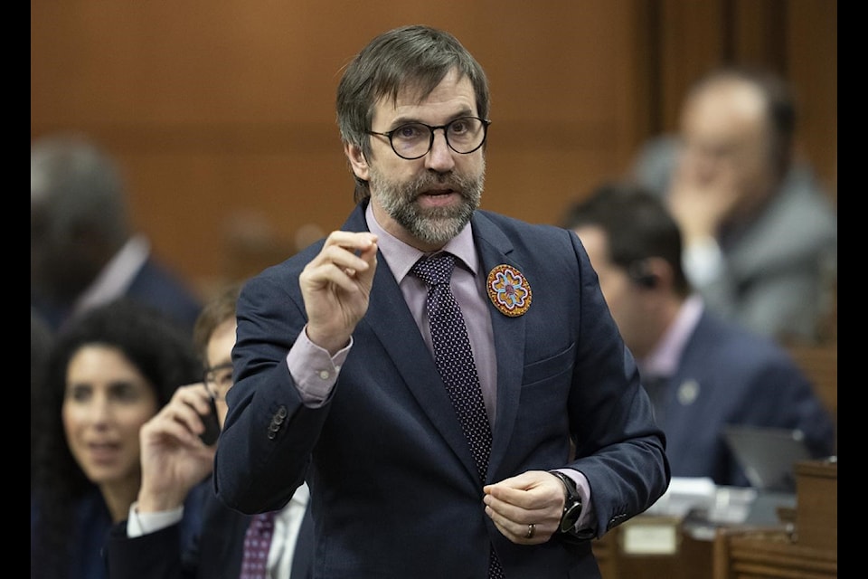 Minister of Environment and Climate Change Steven Guilbeault rises during Question Period, Thursday, February 16, 2023 in Ottawa. 