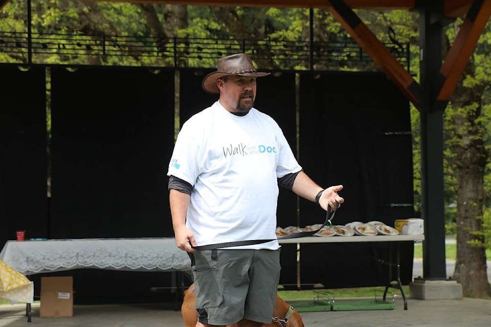 Dr. Joshua Greggain addressing the crowd on the bandstand,