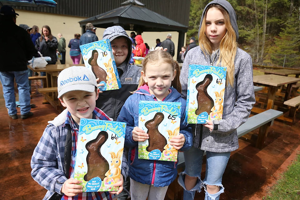 Austin Pittman, left, Triston Wight, Brynn Dougall and Kaitlynn Dougall proudly display their chocolate prizes after Sunday’s Easter hunt at Yale and District Community Centre. Greg Laychak/Black Press