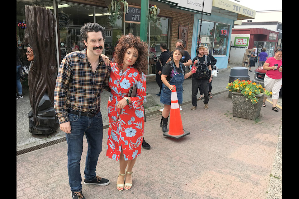 Andrew Barber (“Rene”), left, and Angela Galanopoulos (“Michelle”) and their film crew shot scenes from the second episode of Michelle’s, on Wallace Street Aug. 23. The two actors are also the creators of the Canadian soap opera set in Hope. Emelie Peacock/Hope Standard