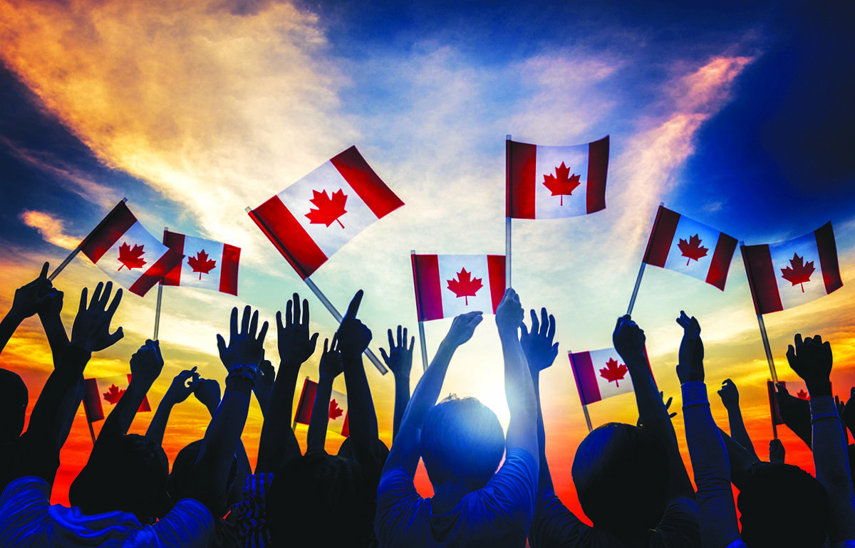 17439390_web1_Canada-Day-Waving-Flags-Metro