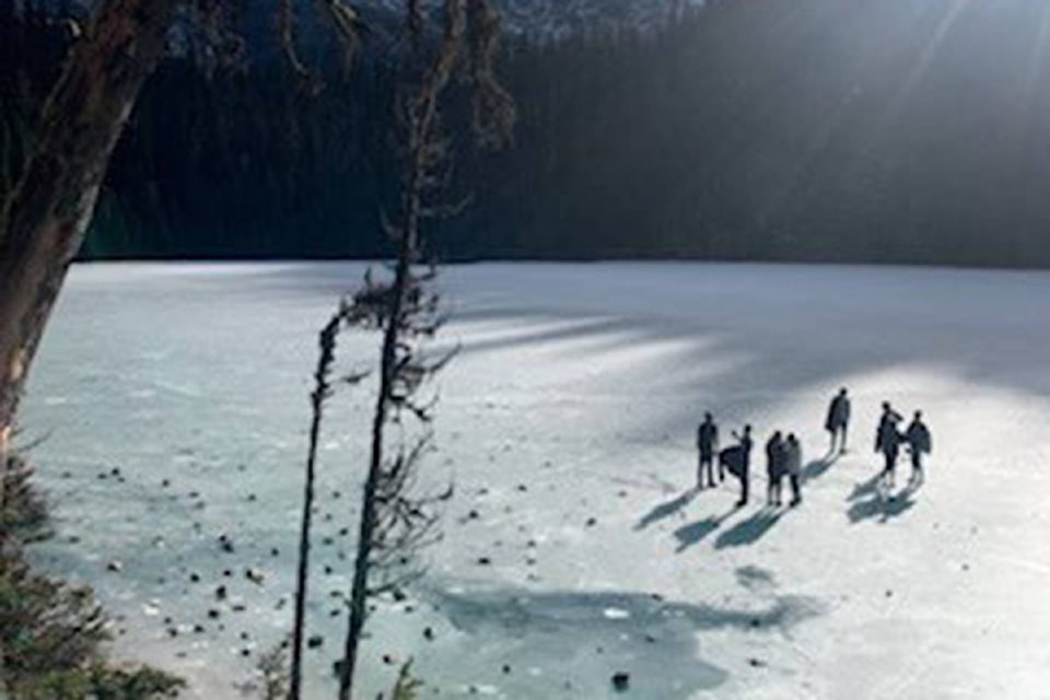A group of people seen on top of thin ice at Joffre Lakes on Nov. 10, 2019. (Whistler RCMP)