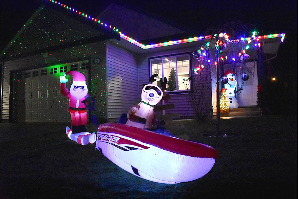 This home in the Silvervalley Estates on Beacon Road featured Santa and a reindeer waterskiing. The majority of homes in the estate were lit up for the Christmas Lights contest. (Emelie Peacock/Hope Standard)