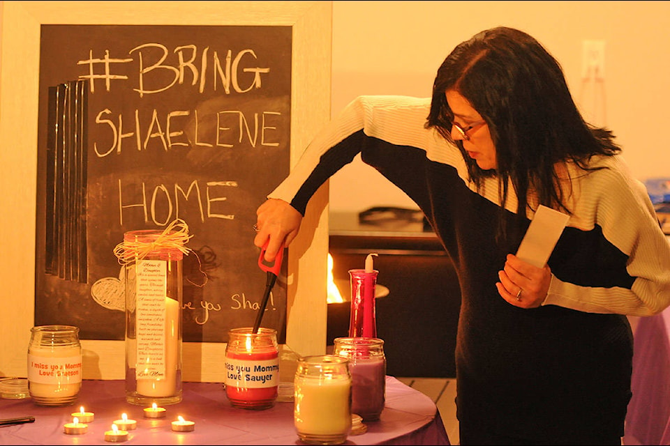 Alina Durham, mother of Shaelene Bell, lights candles on behalf of Bell’s two sons during a vigil on Saturday, Feb. 27, 2021. (Jenna Hauck/ Chilliwack Progress)