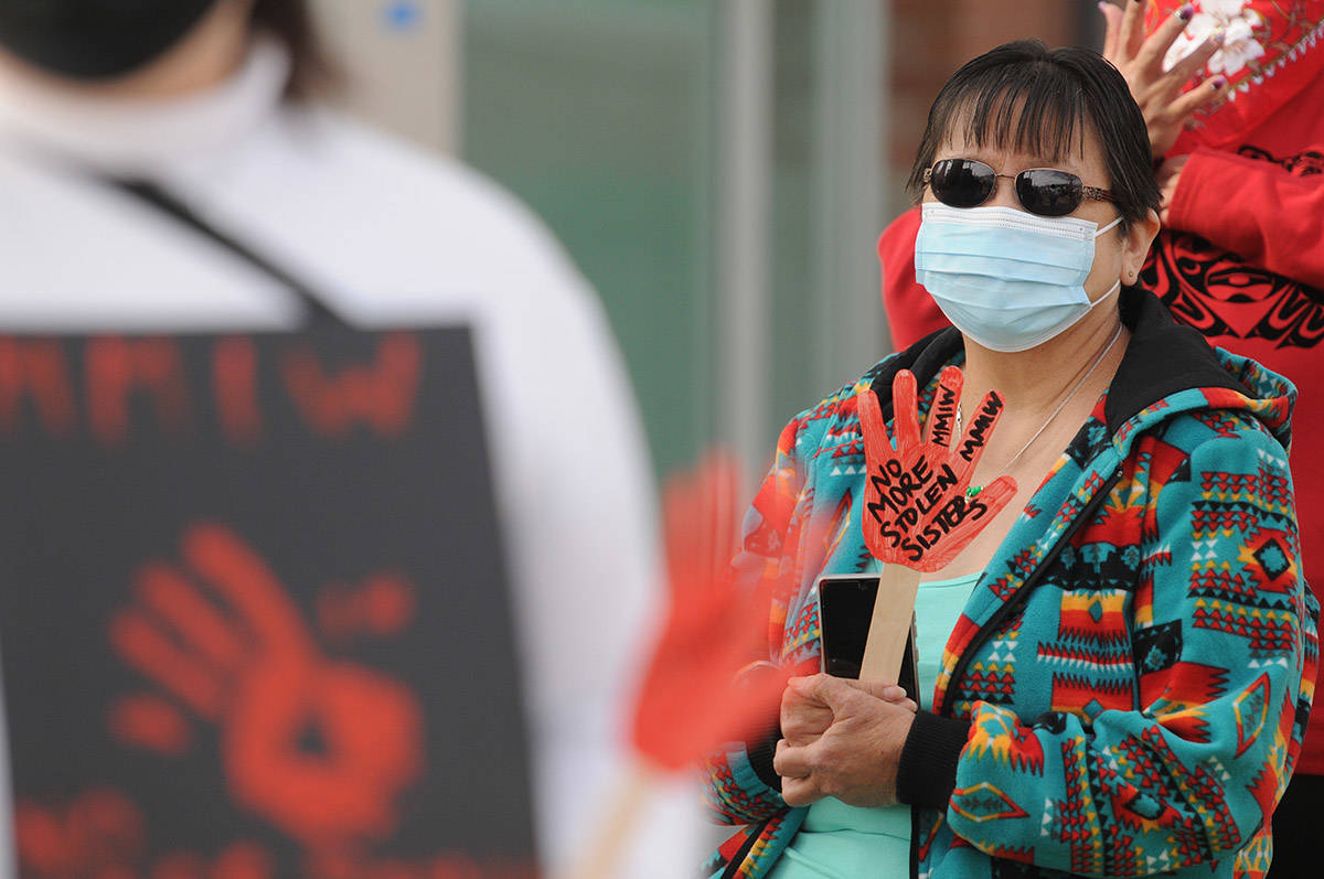 About 30 people gathered at Five Corners in Chilliwack on Saturday, March 13, 2021 for MMIW Takes Back Canada, a nationwide endeavour to draw attention to the issue of missing and murdered Indigenous women. (Jenna Hauck/ Chilliwack Progress)