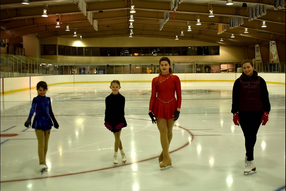 Hope Skate Club members (left to right) Briella Rodney, Zoey Dillon, Desiree Zerr and coach Sarah Steberl pose for a photo at the Hope Ice Arena (Photos/Adam Louis)