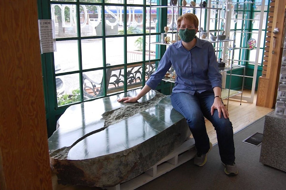 Heidi Roy of the Cariboo Jade Shop in Cache Creek with the 3,000 jade boulder, which is now on secure display inside the shop. (Photo credit: Barbara Roden)