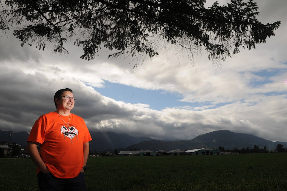 Shawn E. Baginski has been selling orange shirts he designed with all proceeds going to survivors of residential schools. He is pictured here in Chilliwack on Sept. 28, 2021. (Jenna Hauck/ Chilliwack Progress)