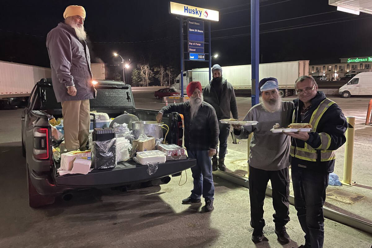 This team of Sikh volunteers drove all night to feed stranded travellers in Princeton and Manning Park. (Khalsa Aid Canada photo)