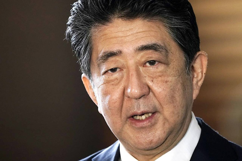 FILE - Japan’s outgoing Prime Minister Shinzo Abe speaks to the media as he arrives at the prime minister’s office for a cabinet meeting in Tokyo on Sept. 16, 2020. Japan’s NHK TV says on Friday, July 7, 2022, former Prime Minister Abe apparently was shot at and collapsed during a campaign speech. (AP Photo/Eugene Hoshiko, File)