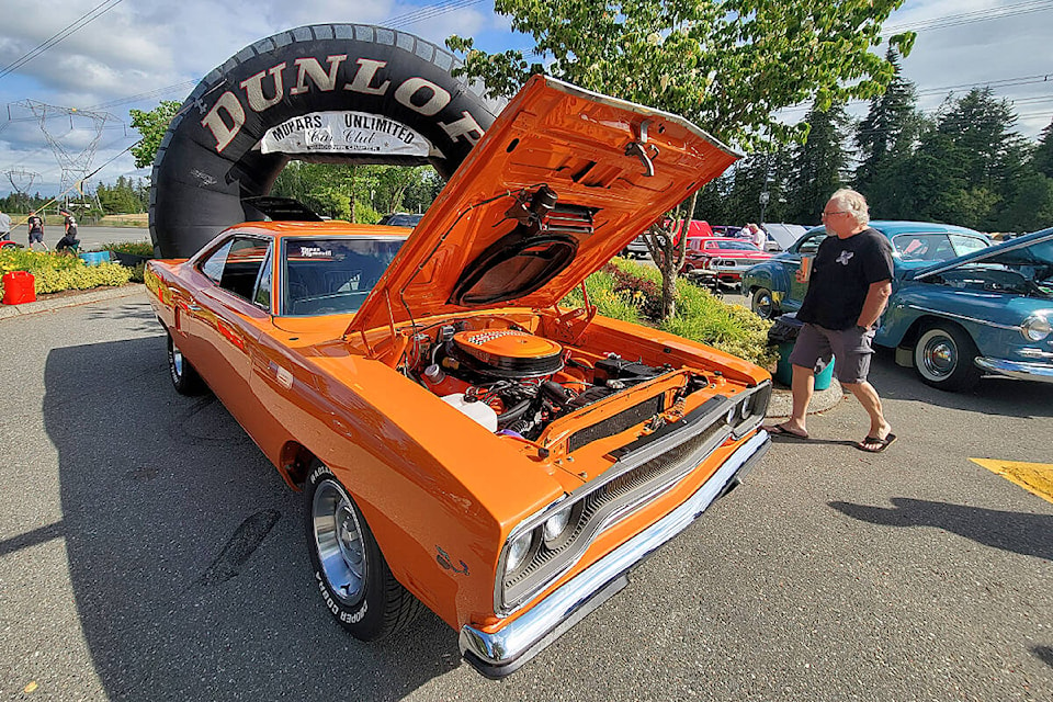 At the 29th edition of the Mopar Madness car show in Langley on Sunday, July 10, members of the Mopars Unlimited Car Club announced they have raised $10,000 for Ukraine humanitarian relief. (Dan Ferguson/Langley Advance Times)