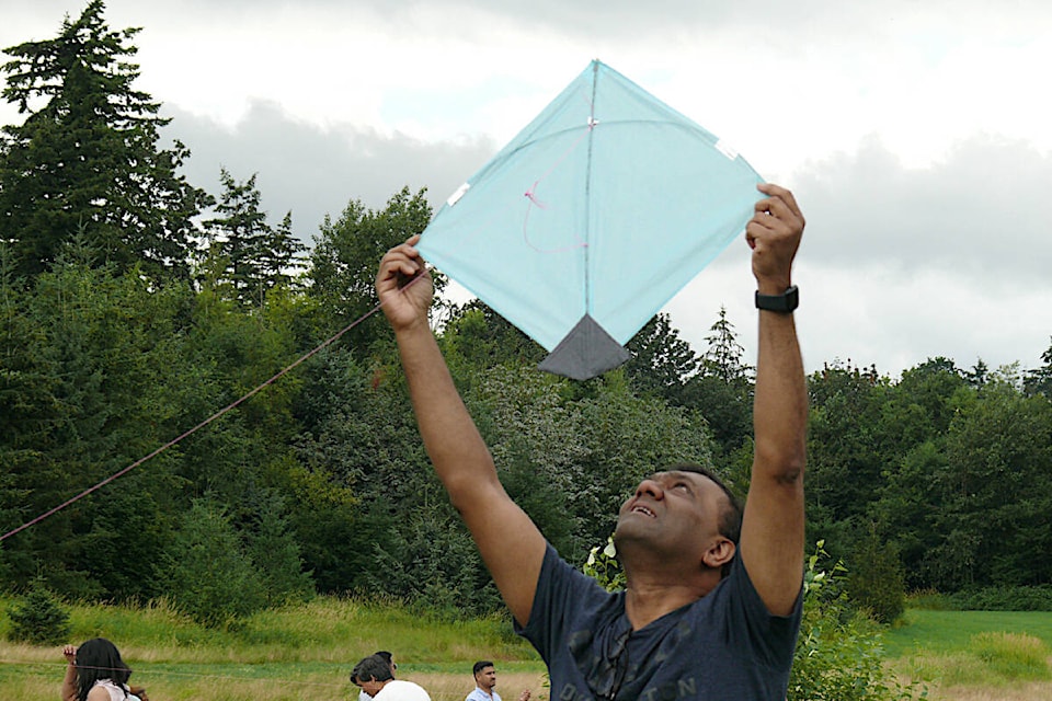 Preparing for launch. More than 300 people took part in the first kite flying and family picnic event of its kind in the Lower Mainland on Sunday, July 17, organized at the Aldergrove Bowl Park by the Canadian Desi Arts and Culture Club. (Dan Ferguson/Langley Advance Times)