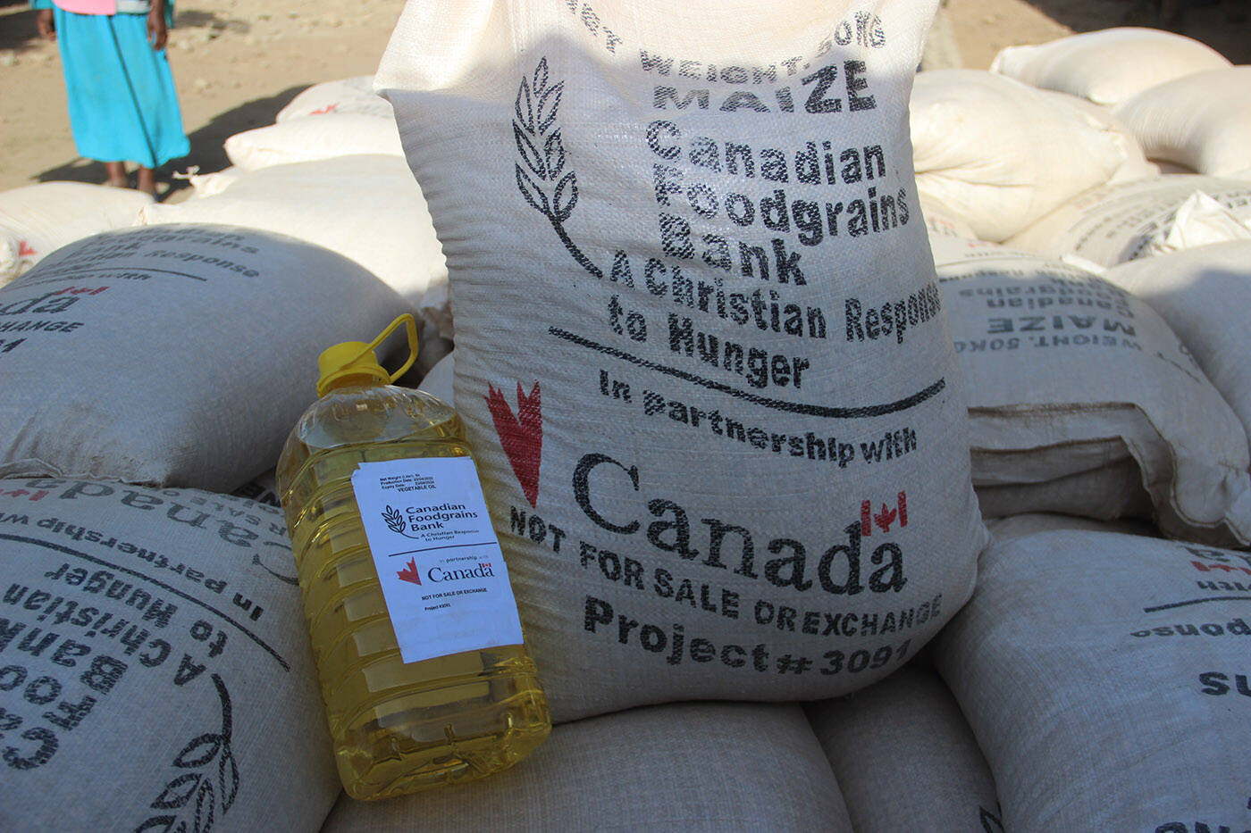 Sacks of food and a container of cooking oil from Canadian Foodgrains Bank in Ethiopia in July. (Canadian Foodgrains Bank)