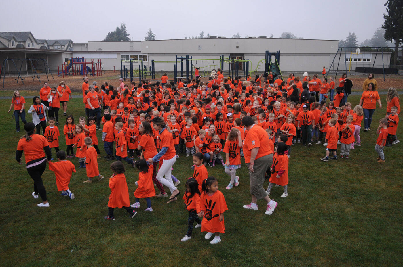 Children disperse after posing for a group photo at Bernard Elementary on Thursday, Sept. 29, 2022. The schools parent advisory council bought an orange T-shirt for every single student at Bernard. (Jenna Hauck/ Chilliwack Progress)