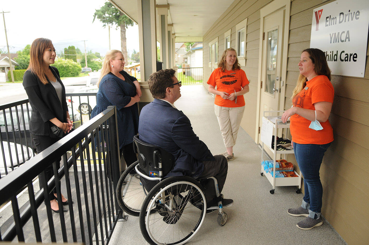Amanda Adams (right) with Elm Drive YMCA Child Care Centre was awarded a certificate of achievement in the 2022 Prime Ministers Awards for Excellence in Early Childhood Education. She is seen here on June 21, 2022 taking dignitaries on a tour of the daycare centre in Chilliwack. (Jenna Hauck/ Chilliwack Progress file)