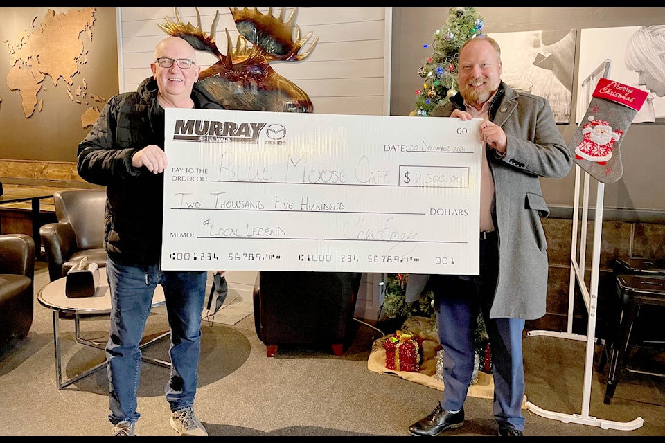 Blue Moose Coffee House owner Wes Bergmann receives a cheque from Murray Mazda general manager Chris Emery as part of Mazda Canada’s Local Legends initiative. (Murray Mazda photo)