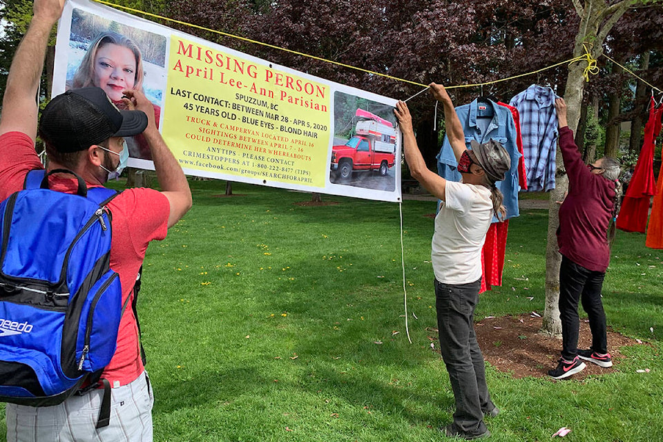 Gordon Howard, centre, helped set up the Missing and Murdered Indigenous Women and Girls event in Hope on May 5, 2021. He helped place a banner with information about April Parisian, who had been missing for just over year at the time and has now been missing for nearly two years. (Jessica Peters/ Hope Standard)