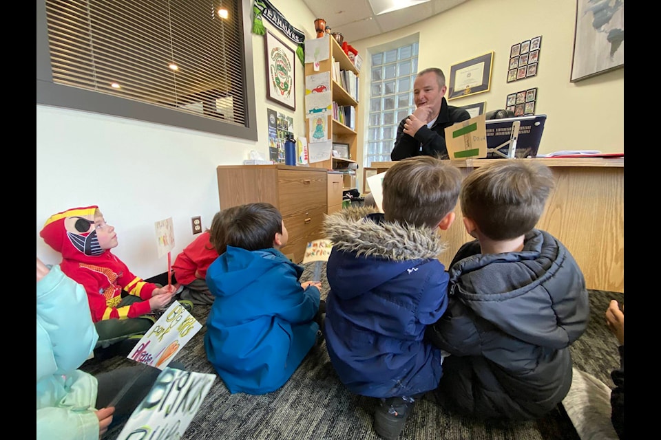 Dustin Neufeld’s first grade students sat in front of principal Bruce Becker’s desk in order to have their demands heard. (Dustin Neufeld)