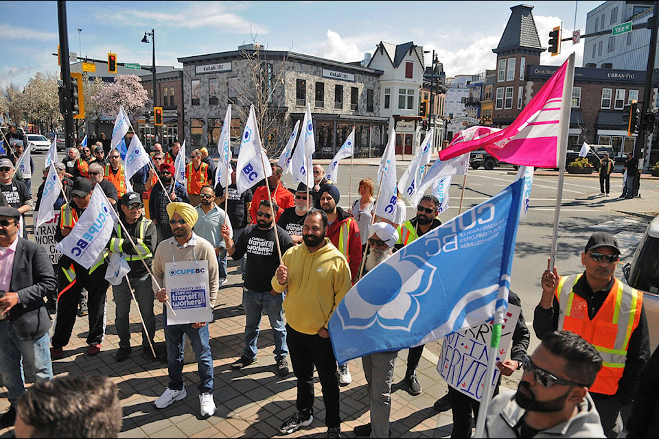 More than 100 people came out for a public rally at Five Corners in downtown Chilliwack on Wednesday, April 12, 2023 in support of CUPE 561, whose members have been on the picket lines for more than three weeks since the full withdrawal of transit services in the Fraser Valley. (Jenna Hauck/ Chilliwack Progress)