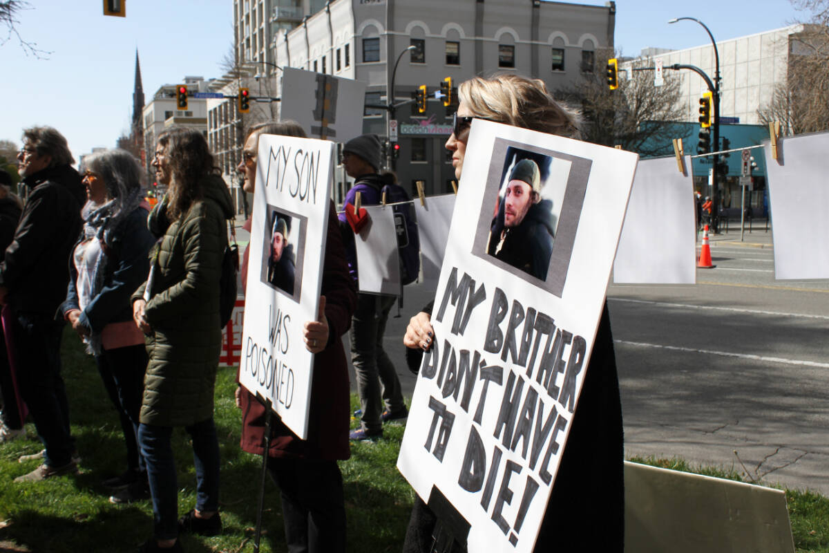 Safe supply advocates hold a rally outside the B.C. Ministry of Health in downtown Victoria April 14. The day marks seven years since the province declared the overdose public health emergency. (Austin Westphal/News Staff)