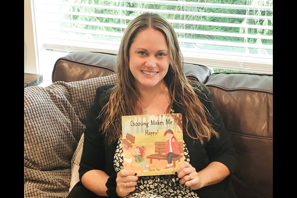 Sarah Van Reeuwyk, the author of ‘Choosing Makes Me Happy’, poses with her book. With illustrations by Sümeyye Demir, the story follows Van Reeuwyk’s three year-old daughter as she makes choices throughout the day. (Sarah Van Reeuwyk)