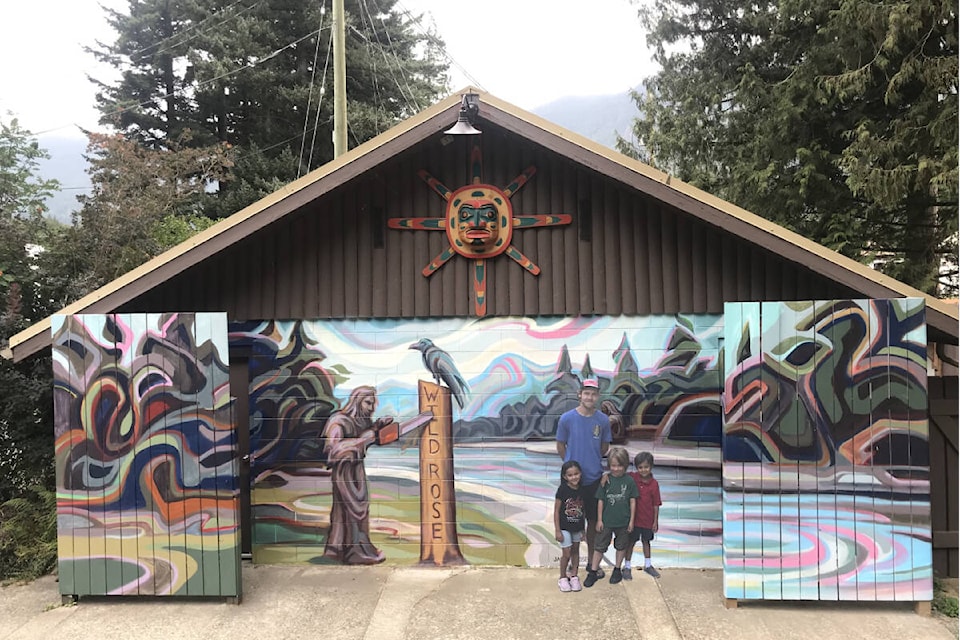 Chilliwack artist Jack Hendsbee, who painted the mural, poses with Naomi Gore (left), Jack Gore (middle), and Wyatt Gore (right), who helped to design the mural. (Tony Gore)