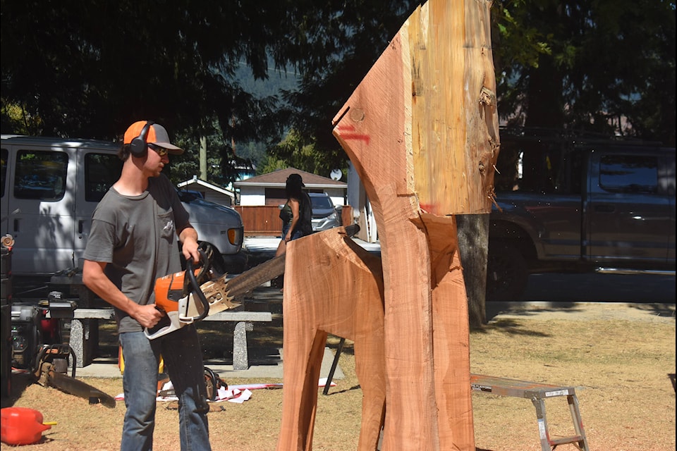Porter Foltz works on his woodcarving piece. (Kemone Moodley/Hope Standard)