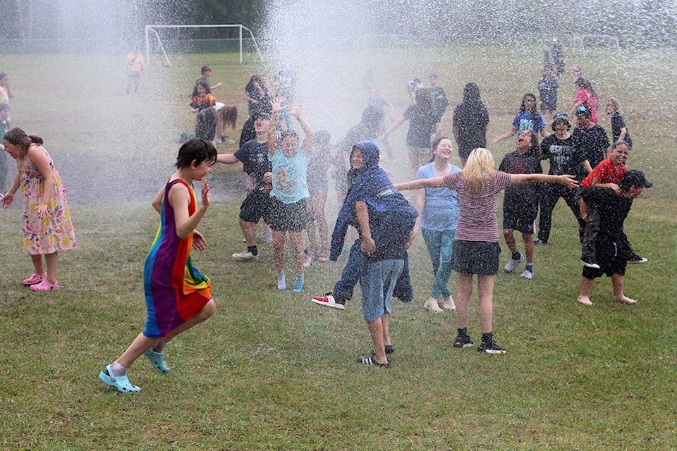 On June 24 at 2p.m. the Houston Fire Department arrived at Twain Sullivan School and parked at the west side of the school. Within ten minutes of setting up, the hoses were spraying the students down. Students were running in and out of the spray of water coming from two hoses. Some youth had swim suits while others were fully clothed. This event is an annual tradition to mark the year end of school. Everyone had a great time, even the fire fighters.