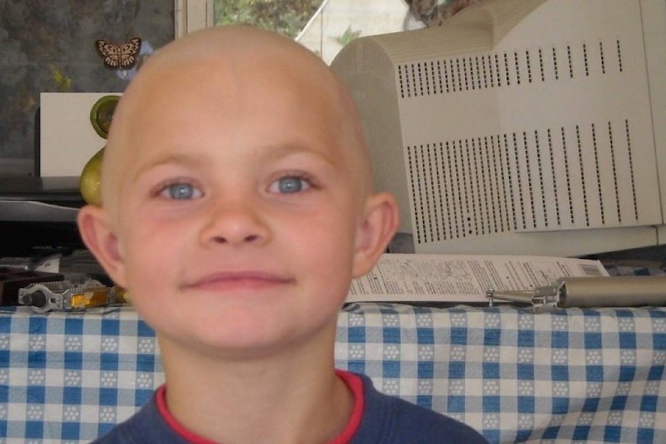 Submitted photo Hayden Johnston-Kopetski smiling proudly after shaving his head for cancer.