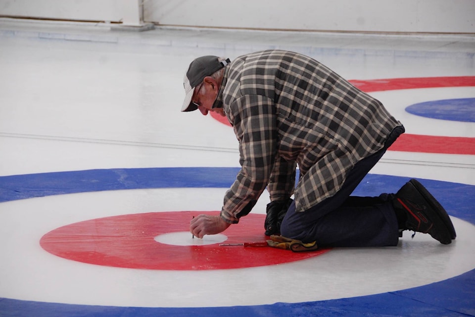 Heat exchanger has been replaced, and members of the Houston curling rink have started to laying out the rings and lines of the curling lanes before the season begins.