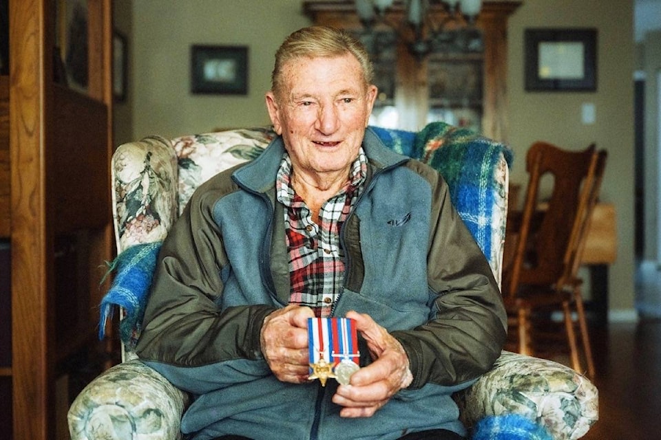 John Andrew McLellan hold his World War II service medals. The 101-year-old received his medals 74 years after the end of the war. (Photo Courtesy Don McLellan)
