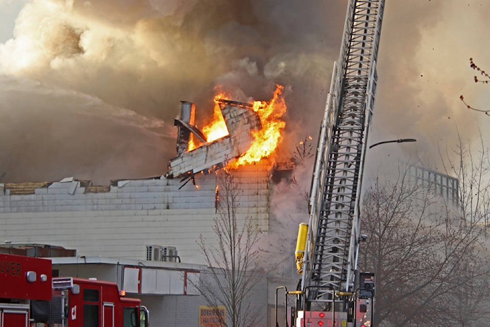 Fire crews battle a blaze at the Duke of Connaught Lodge No. 64 (North Vancouver Masonic Centre) in North Vancouver on Tuesday, March 30, 2021. Shane MacKichan)