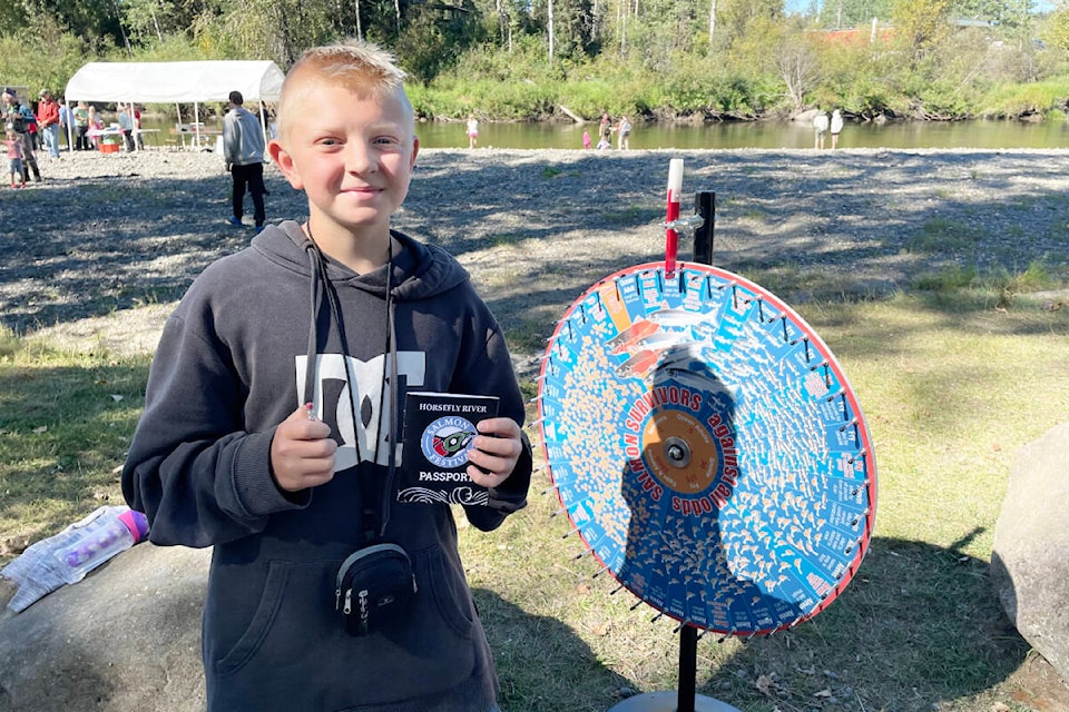 Twelve-year-old Owen Nowlin from Horsefly, was searching for the final answers to complete his passport at the festival. (Ruth Lloyd photo - Williams Lake Tribune)