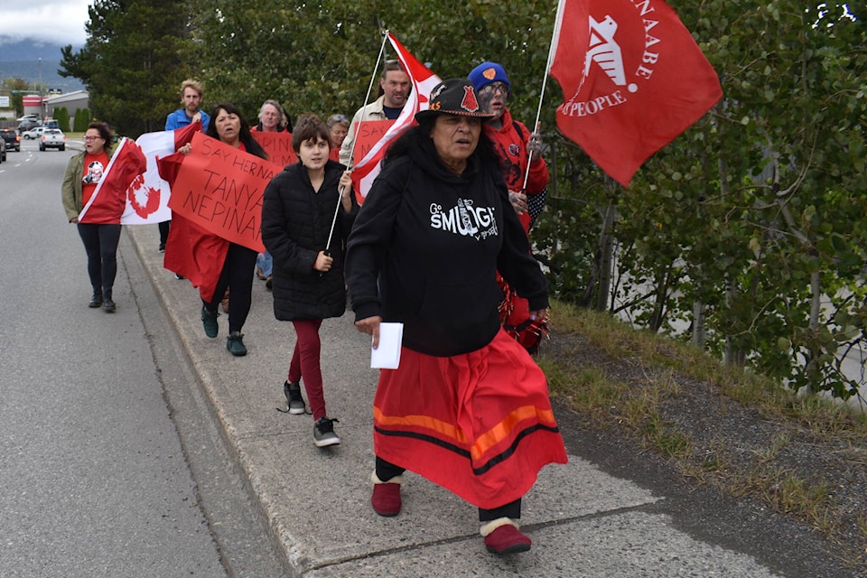 Gladys Radek leads a determined group of protesters along Highway 16, near Eby Street in Terrace, amplifying the call for justice for missing and murdered Indigenous women and girls. (Viktor Elias/Terrace Standard)