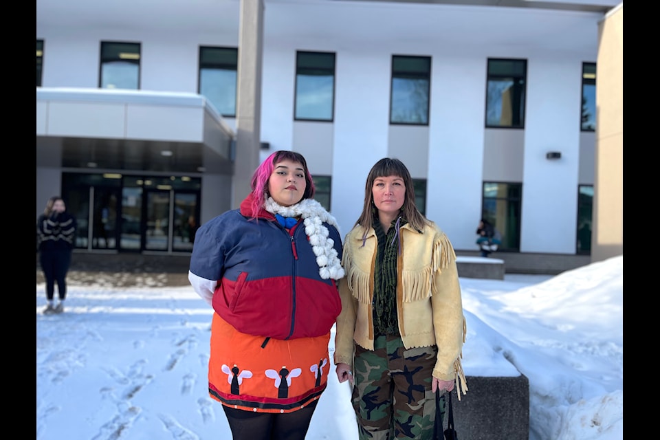 Shaylynn Sampson and Sleydo' (Molly Wickham) stand infront of the Smithers courthouse on Feb 18.