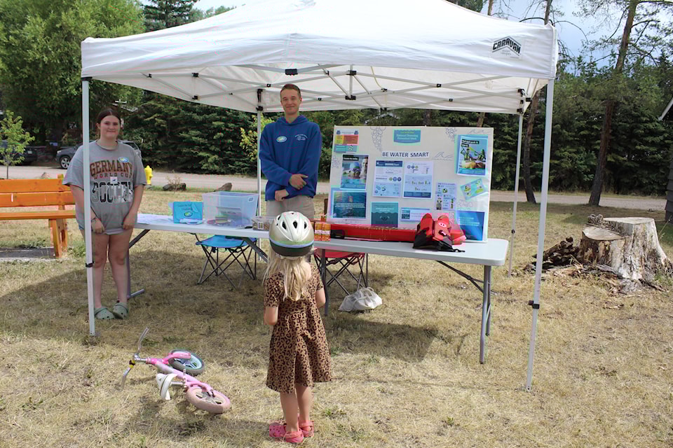 Kadence and Levi from the Bulkley Valley Pool educate people in Telkwa about drowning prevention during National Drowning Prevention Week.