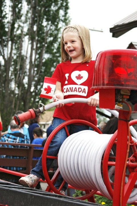 Hannah Groothof plays on a firetruck outside the Telkwa Museum on Canada Day.