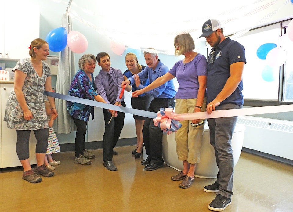 12145768_web1_Smithers-maternity-ribbon-cut