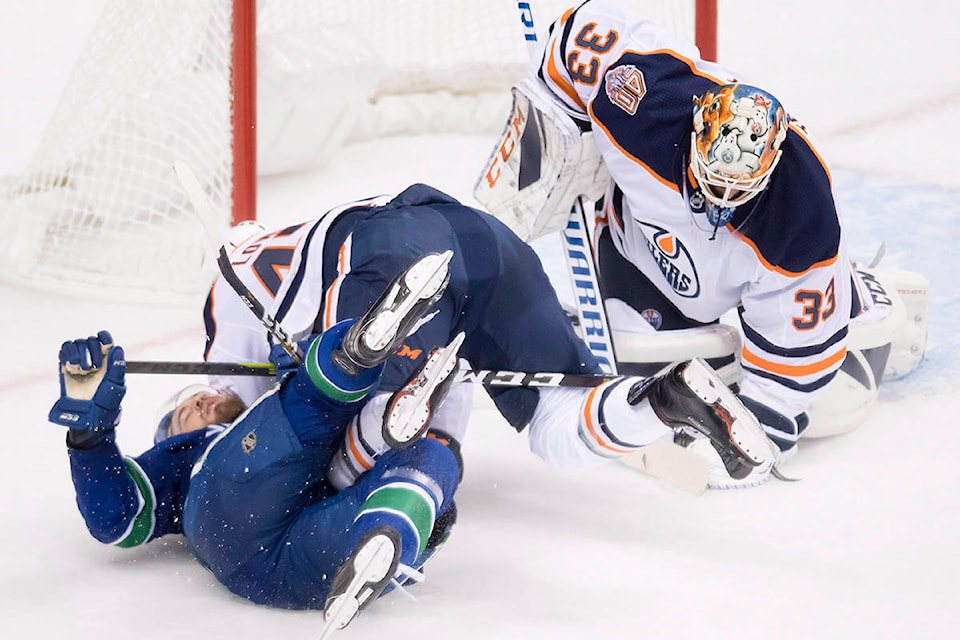 13613639_web1_180918-IFD-Canucks-Oilers2