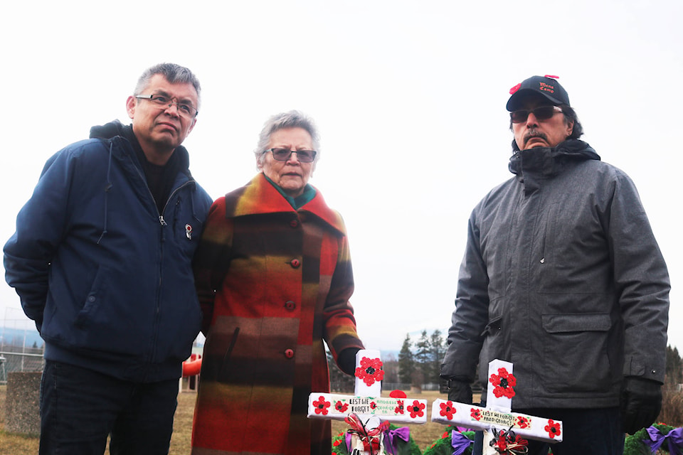 (Left to right) Andy George Jr, Rita George, and Darren George stand with a cross Rita made in honour of her late husband and brother, both of whom served in the Second World War. The cross also serves as thank-you to all the other Indigenous soldiers who lost their lives in war. Michael Grace-Dacosta photo