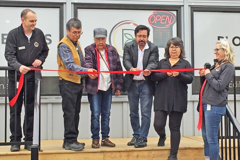 From left, Mike Scott, Indigenous Bloom (IB); Ron Mitchell, Lax silyu clan; Katherine Naziel, Lax silyu clan; Robert Louie, Chairman, IB; Millie Gunanoot, Lax silyu clan; Carol McQuaide, IB, cut the ribbon on the First Nation’s new Indigenous Bloom cannabis shop July 3. (Grant Harris photo)