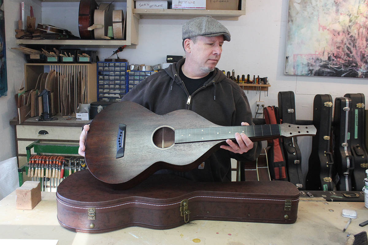 24505969_web1_210318-SIN-OUR-TOWN-Mark-Thibeault-hawaiian-guitar_1