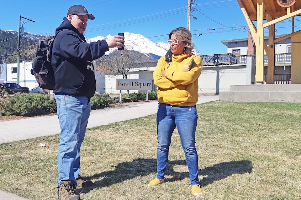 Dze L K’ant executive director Annette Morgan, right, discusses the issue of Goodacre Place deaths via video chat at Bovill Square April 23. (Thom Barker photo)